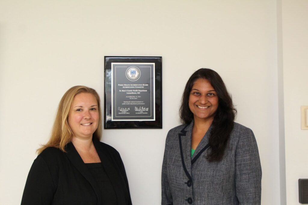 Picture of Kyle Bishop, Deputy Health Officer and Meena Brewster, Health Officer with the Public Health Accreditation Board plaque for St. Mary's County Health Department. 