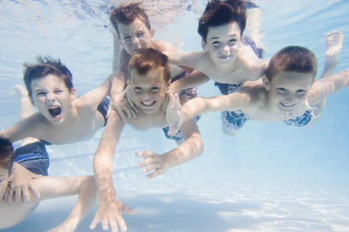 kids playing in a swimming pool